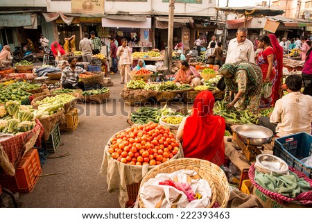 UDAIPUR, RAJASTAN- INDIA :MAY 27 2013 - Unidentified people selling vegetables on a street market on May 27, 2013 in Udaipur, India.