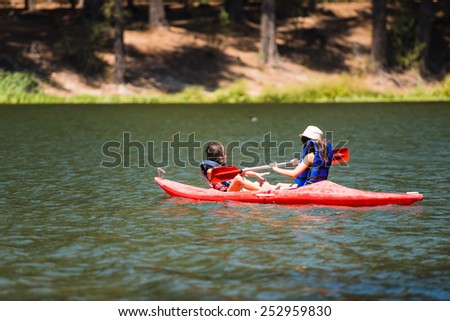 SAN FERNANDO, SEXTA REGION / CHILE - FEBRUARY 15 2015 - Two Unidentified girls doing water sports at San Fernando Lake.