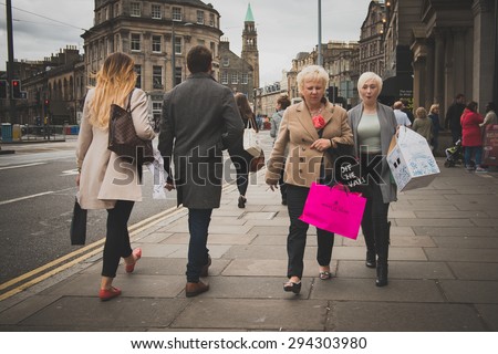 EDINBURGH, SCOTLAND / UNITED KINGDOM - MAY 24 2015 - Unidentified people with lot of style walking the streets of Edinburgh