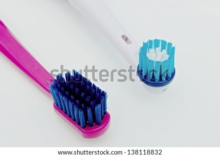toothbrush with electrical toothbrush on a white background
