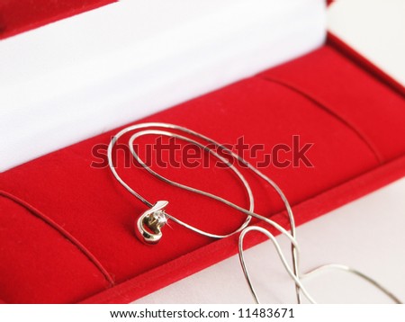 Gold necklace in red jewel box