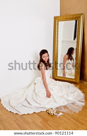 Beautiful dark haired woman in white bridal dress