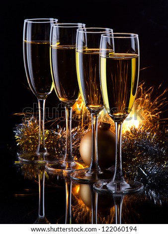 four champagne glasses ready to bring in the New Year