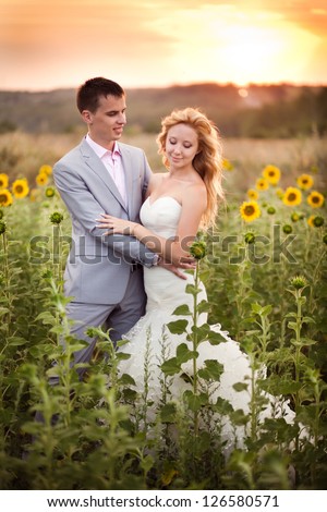 Beautiful young bride, in the wedding day with her beautiful groom