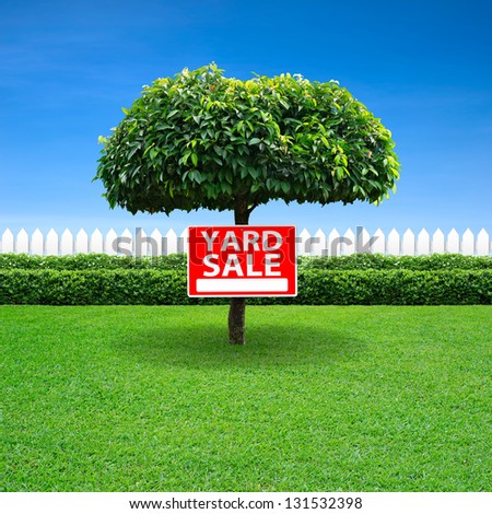 Yard sale sign on tree