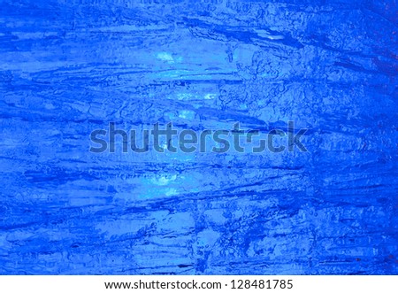 Texture of ice  with blue back light. Abstract background.