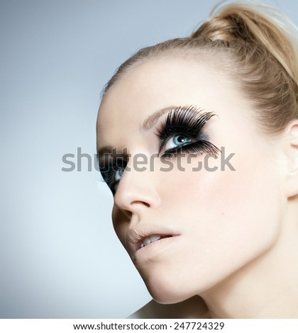 Model with exaggerated eye lashes.