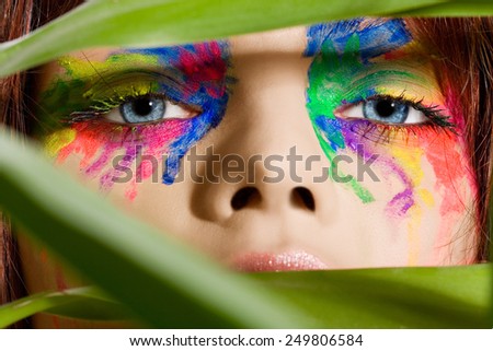 Fashion model with ultra colorful makeup.