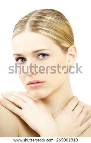 Young natural blond Caucasian woman in bright light over white background.