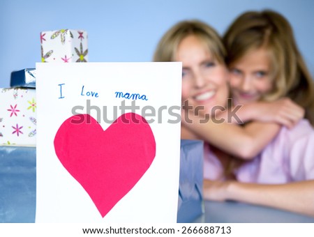 Mother and daughter posing with gifts for Mother's Day.