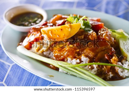 Barbecued pork and crispy pork in red sauce with rice