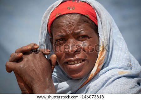 SAHARA DESERT, DJANET, ALGERIA, MAR 01: Tuareg woman in the Sahara desert, Djanet, Algeria, March 01, 2011. Nomadic tribes living in the desert, and a traditional lifestyle as a hundred years ago.