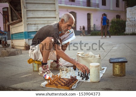HAVANA, CUBA - JUNE 22: The unidentified man playing chess in Havana. Havana, Cuba, June 22, 2013. Chess is one of the most popular games in Cuba, a lot of people playing chess on the street.