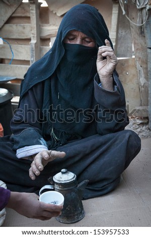 SAHARA DESERT, EGYPT - YAN 26: Portrait of the unknown old berber woman in the Sahara Desert, Egupt, Yanuary 26, 2010. Tribes of bereber wander across all North Africa from Morocco to Egypt.