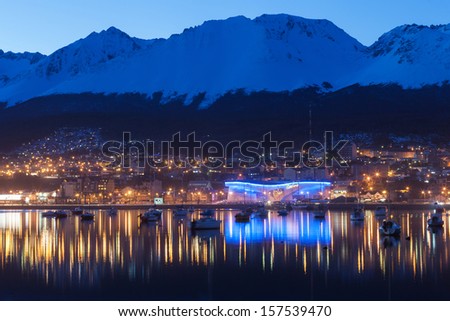 A night view of Ushuaia, Tierra del Fuego. Boats line the harbor