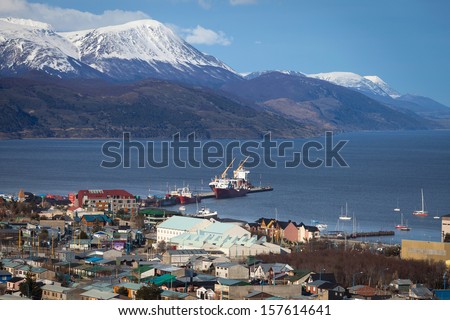 A View Of Ushuaia, Tierra Del Fuego. Boats Line The Harbor In Us