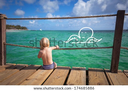 The child dreams on a sea beach