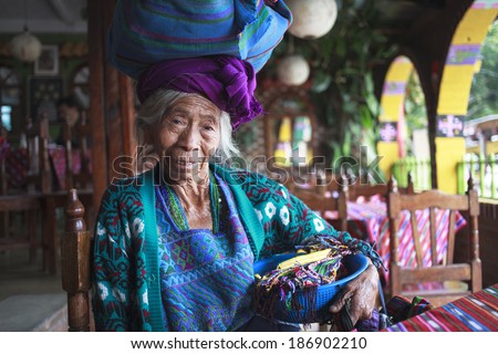 PANAJACHEL, GUATEMALA - APRIL 05: Old woman in ethnic traditional Central American dress, Panajachel, Guatemala, 05 Aplil, 2014. Descendants of Indians Maya still live in Guatemala