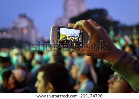 BUENOS AIRES, ARGENTINA - JULY 13, 2014: Soccer fans on the streets of Buenos Aires at the final game of World Cup 2014 between Argentina and Germany. July 13, 2014, Buenos Aires, Argentina