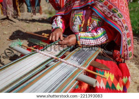The woman weaves multi-colored fabrics, Huillos, Sacred Valley, Peru