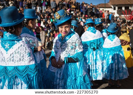 CUZCO, PERU - SEPTEMBER 7: The unknown Peruvian people participating in a religious holiday in Cuzco, Peru, 7 September 2014. Every year in Cuzco passes many religious holidays and carnivals