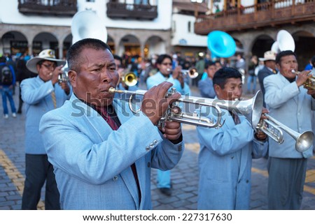 CUZCO, PERU - SEPTEMBER 7: Unknown musicians of a brass band on parade in Cuzco, Peru, 7 Septiembre 2014. Every year in Cuzco passes many religious holidays and carnivals