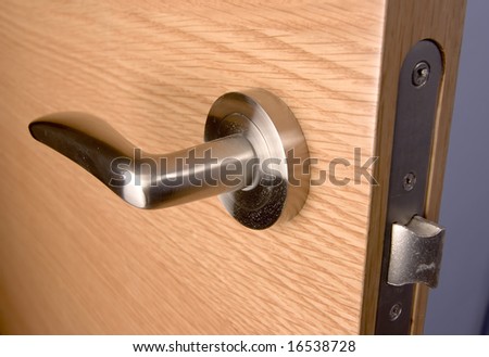 locked wood door and lock handle inside a house as a background