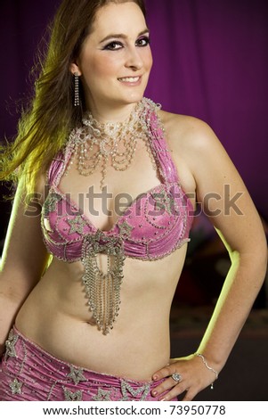 beautiful woman dancing the oriental style dance called belly dance