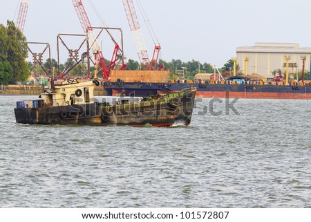 Old tug boat in the port city of Thailand