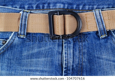 Blue jeans with Gun belt.
