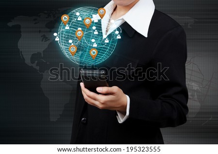 Businessman holding a smartphone with virtual globe and business plan. Concept of business strategy