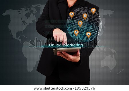 Businessman holding a tablet with virtual globe and business plan. Concept of business strategy
