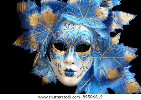 blue and gold venetian mask isolated on a black background