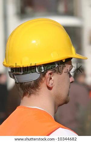 worker in a plastic safety hard hat