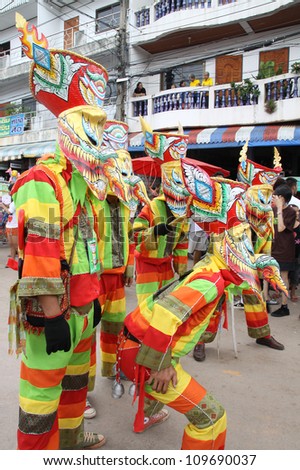 LOEI PROVINCE,THAILAND-JULY 23:Unidentified men wear ghost costumes at Ghost Festival (Phi Ta Khon - a masked procession celebrated by Buddhist) at Dan Sai district in Loei Province on July 23, 2012.