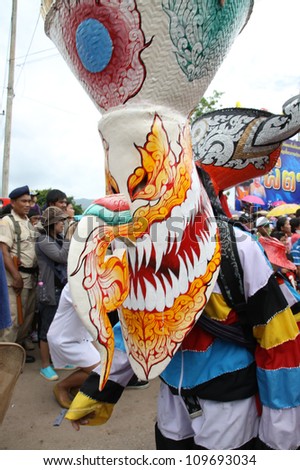 LOEI PROVINCE,THAILAND-JUNE 23:Unidentified men wear ghost costumes at Ghost Festival (Phi Ta Khon - a masked procession celebrated by Buddhist) at Dan Sai district in Loei Province on June 23, 2012.