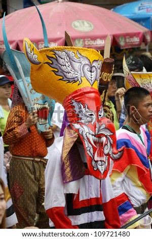 LOEI PROVINCE,THAILAND-JUNE 23:Unidentified men wear ghost costumes at Ghost Festival (Phi Ta Khon- a masked procession celebrated by Buddhist)  Dan Sai district in Loei Province on June 23, 2012.