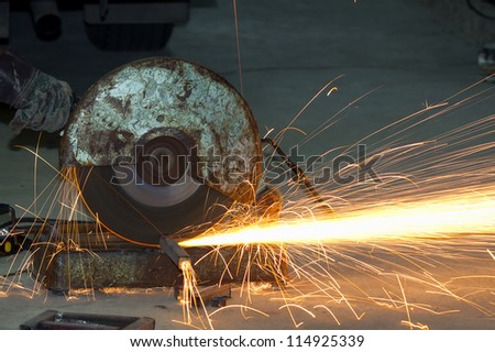 cutting steel with machine for cutting steel by worker