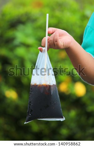 Thai Ice Black coffe bag on hand