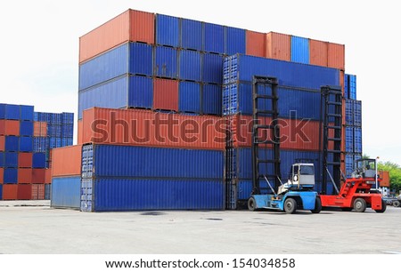 Stack of Freight Containers at the Docks with Truck
