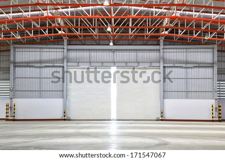 interior of factory with shutter door, day  scene.