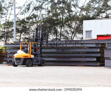 forklift truck transportation steel rods at yard
