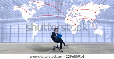 Image of businesswoman  sit on chair at new warehouse  against world map background, Logistics concept