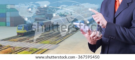 hand presses on world map with digital tablet,Industrial Container Cargo Trains And Truck Of Land Logistic  for Logistic Import Export background (Elements of this image furnished by NASA)