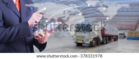 hand presses on world map with digital tablet,export and import goods prepare the delivery of powder bag in warehouse with truck background (Elements of this image furnished by NASA)