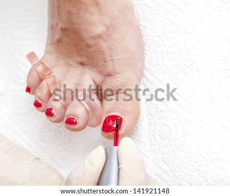 Process of foot nail varnishing, series of photos, Close up of a beautician preparing and applying a nail polish  to a client\'s feet, series of STEP BY STEP nail varnishing process,  selective focus