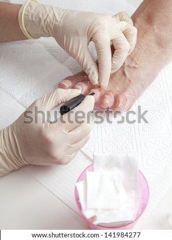 Process of foot nail varnishing, series of photos, Close up of a beautician preparing and applying a nail polish  to a client\'s feet, series of STEP BY STEP nail varnishing process, selective focus