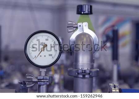 Manometer, precise instrument in nuclear laboratory, close up, selective focus, industrial blue toned