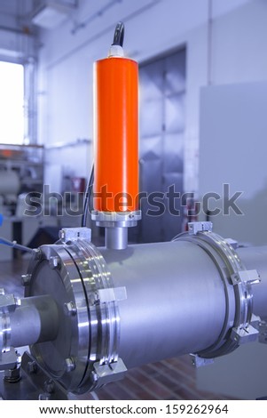 View of Important electronic and mechanical parts of ION Accelerator, CNC machined parts,  selective focus, tilt shift lens, industrial blue toned