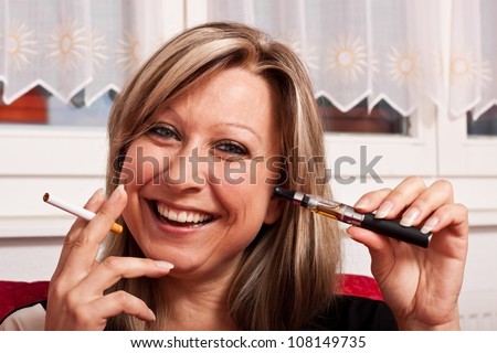 Blonde woman holding a normal cigarette and electrical